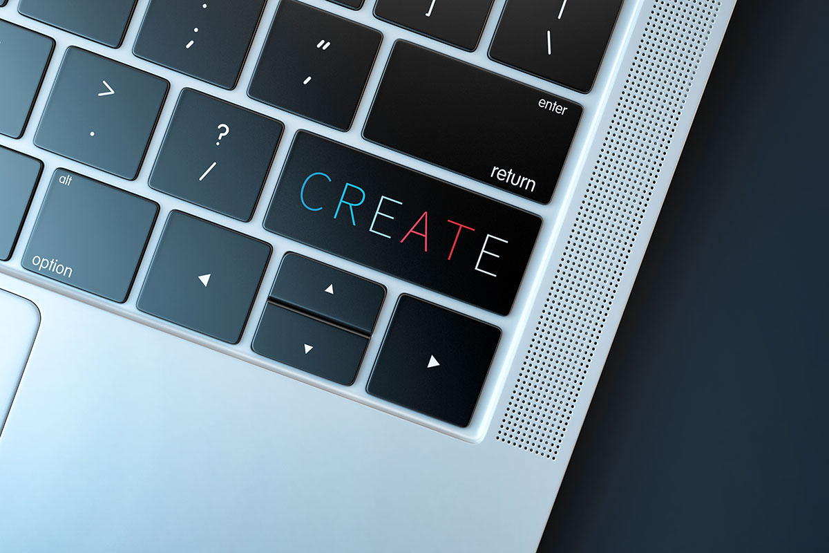 Canva - Keyboard Detail Of A Laptop That Says Create